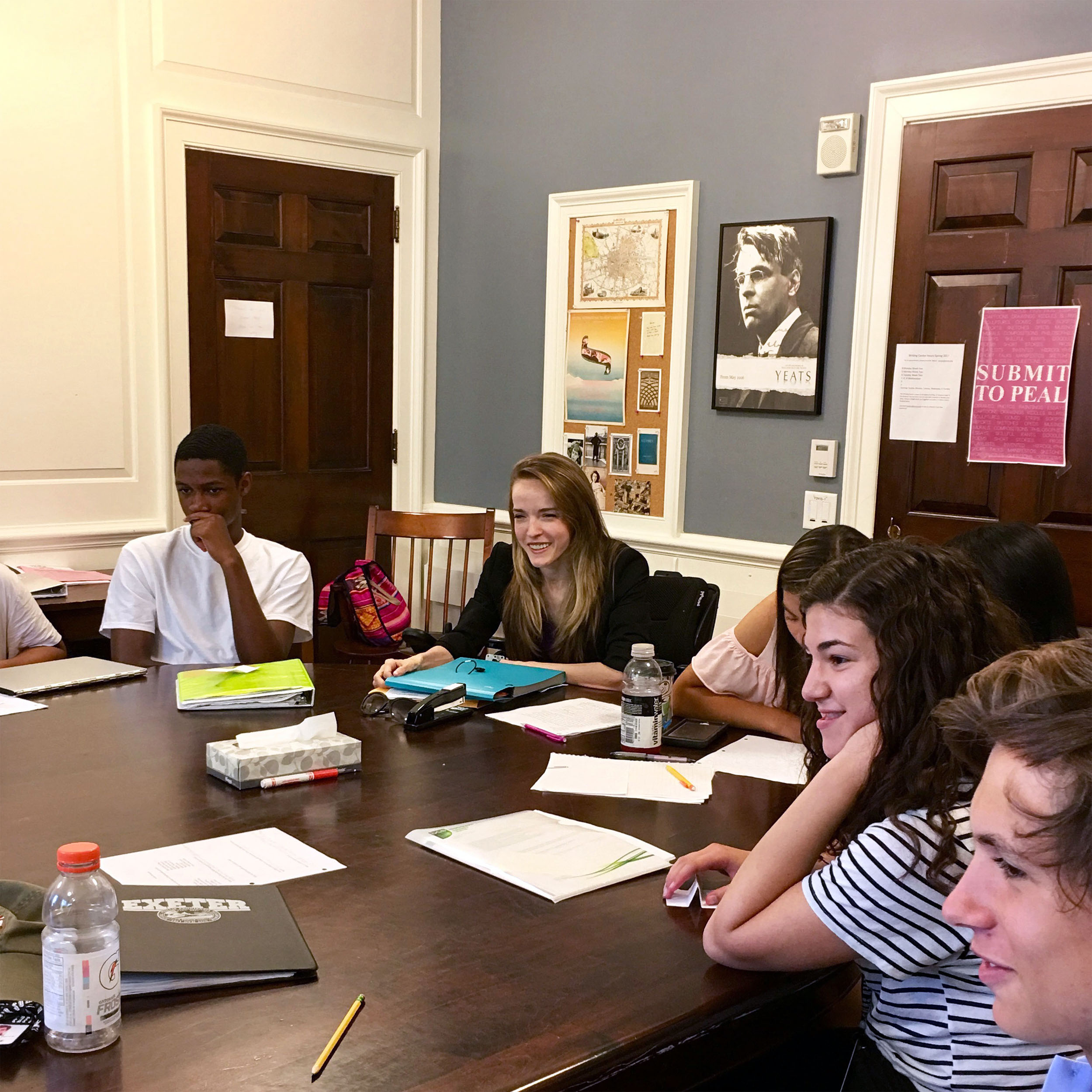 Jane Parris seated at table leading a group of students